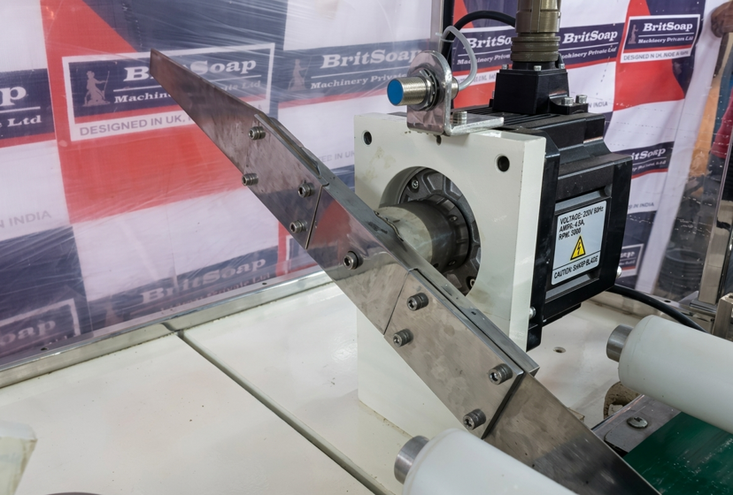 The rotary blade assembly, driven by a high-speed servo motor, rotates through the billet and produces a precise cut.