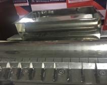 The adjustable roller gaps apply controlled pressure and shearing action, which refines and homogenises the crystalline soap particles.